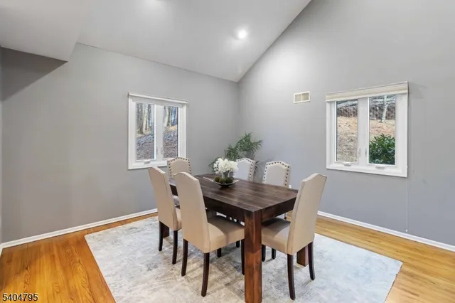 a balcony with wooden floor and fence
