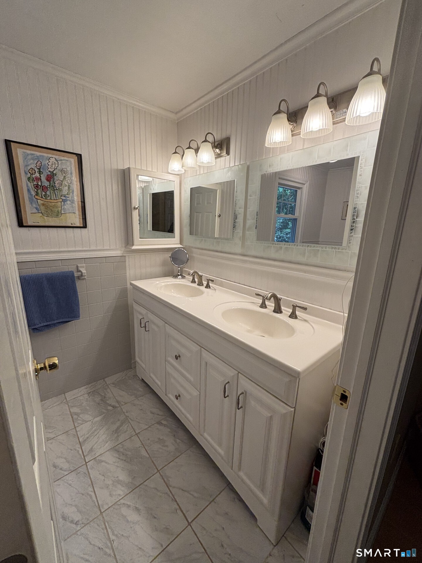 20 Godman Road Madison, CT 06443 - Photo 24 of 29 Remodeled hall bath with double sinks and bath/shower.