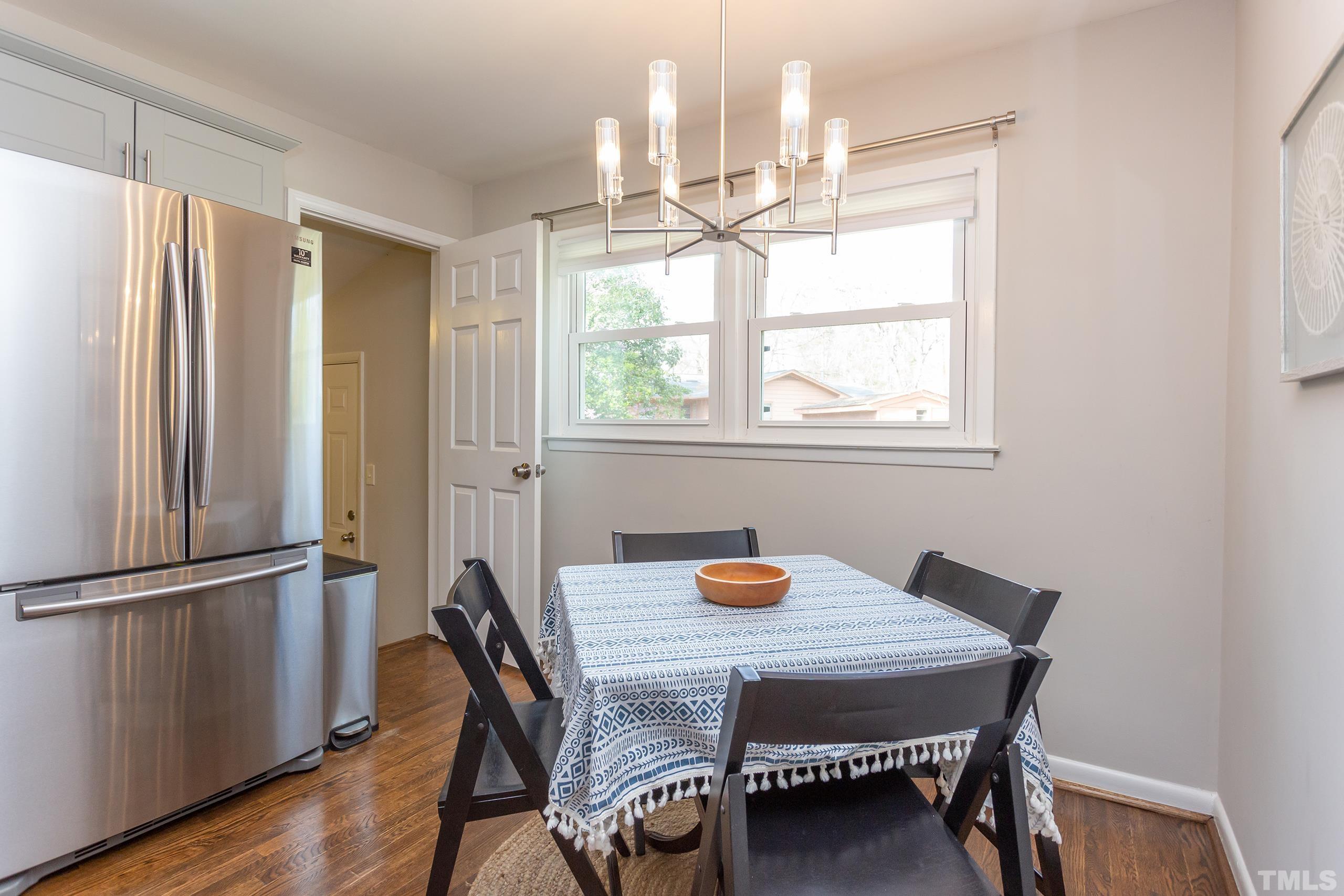 3314 Friar Tuck Road Raleigh, NC 27610 - Photo 14 of 42 a view of a dining table and chairs in a room