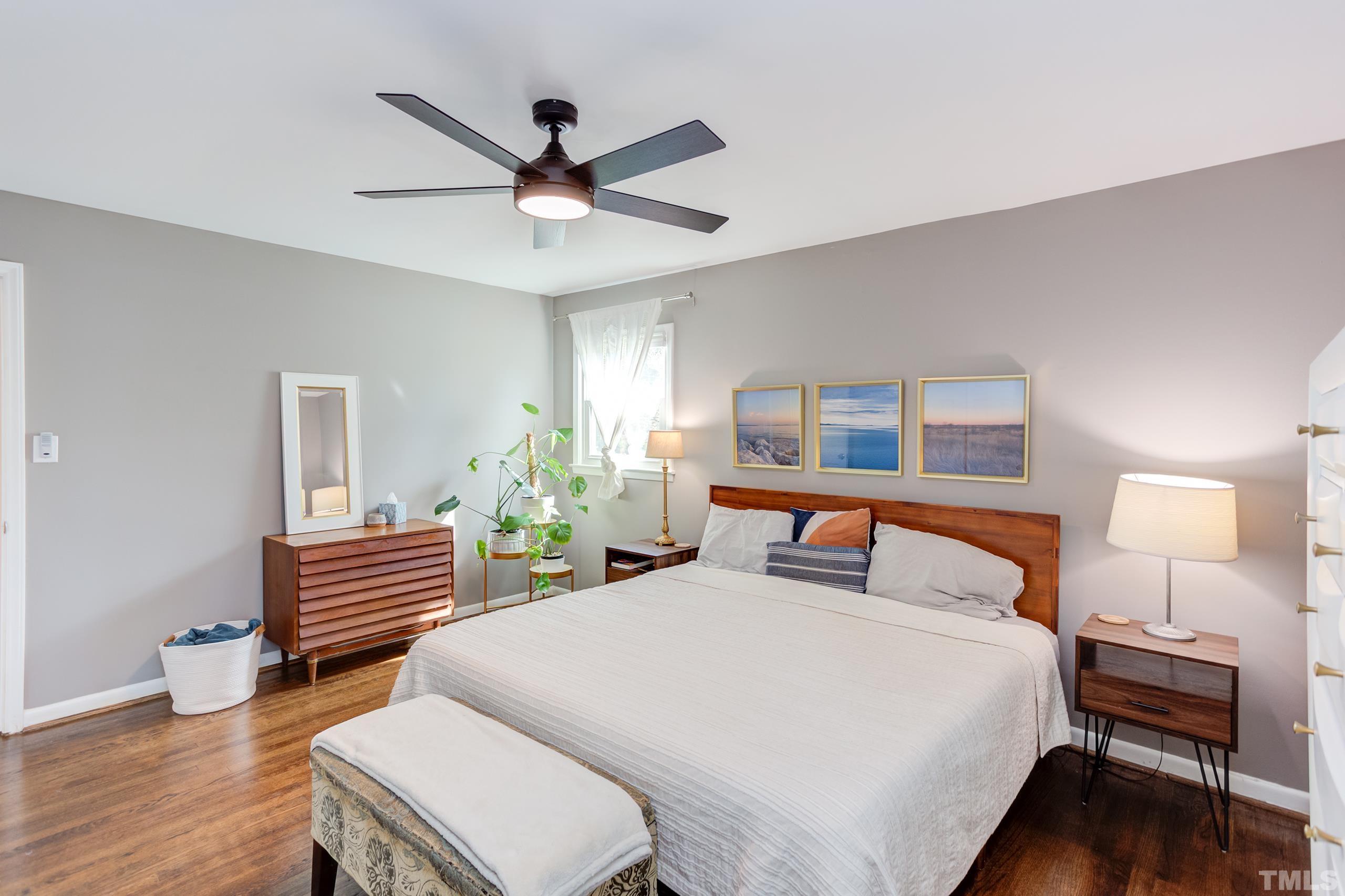 3314 Friar Tuck Road Raleigh, NC 27610 - Photo 16 of 42 a bedroom with a bed and wooden floor