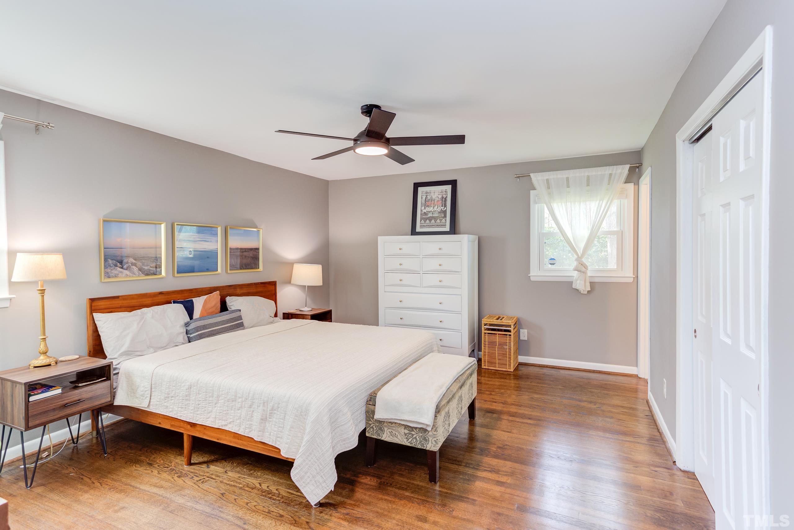 3314 Friar Tuck Road Raleigh, NC 27610 - Photo 17 of 42 a bedroom with a bed and wooden floor