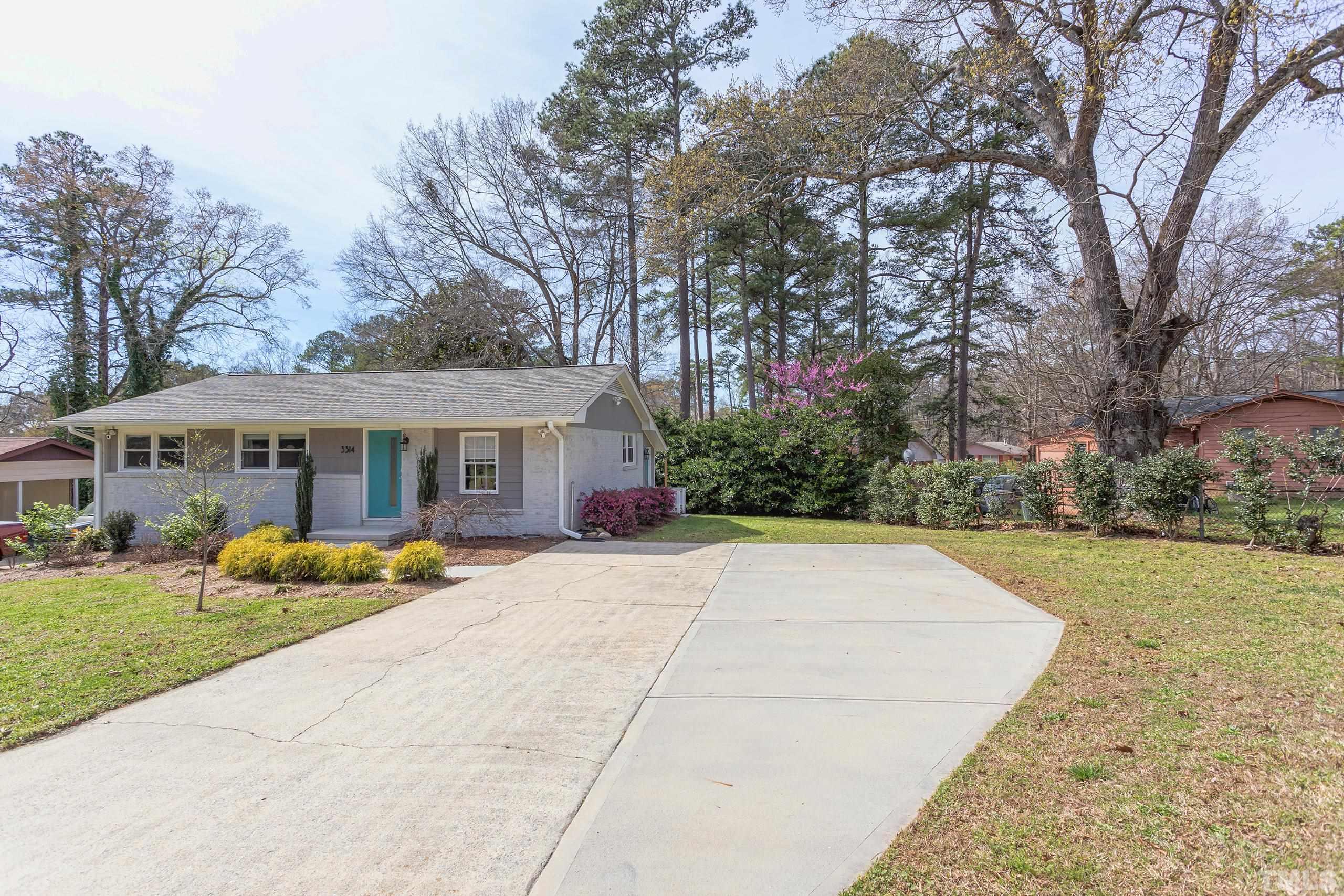 3314 Friar Tuck Road Raleigh, NC 27610 - Photo 2 of 42 a front view of house with yard and trees