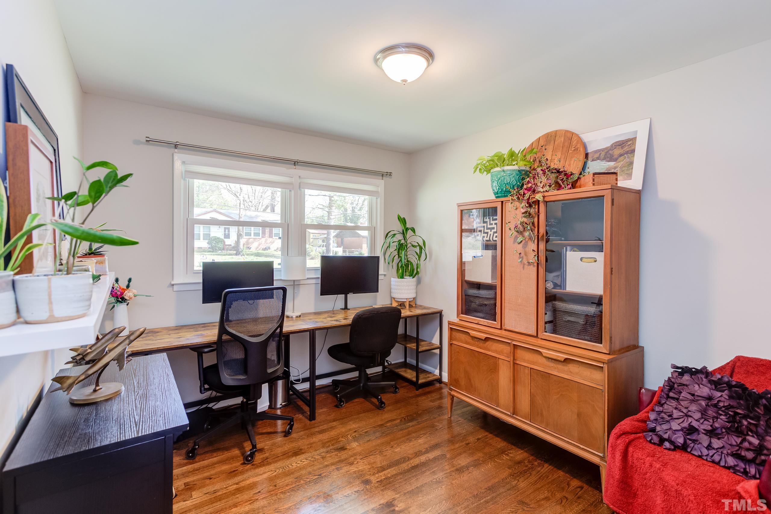 3314 Friar Tuck Road Raleigh, NC 27610 - Photo 22 of 42 a view of a workspace with furniture and a window