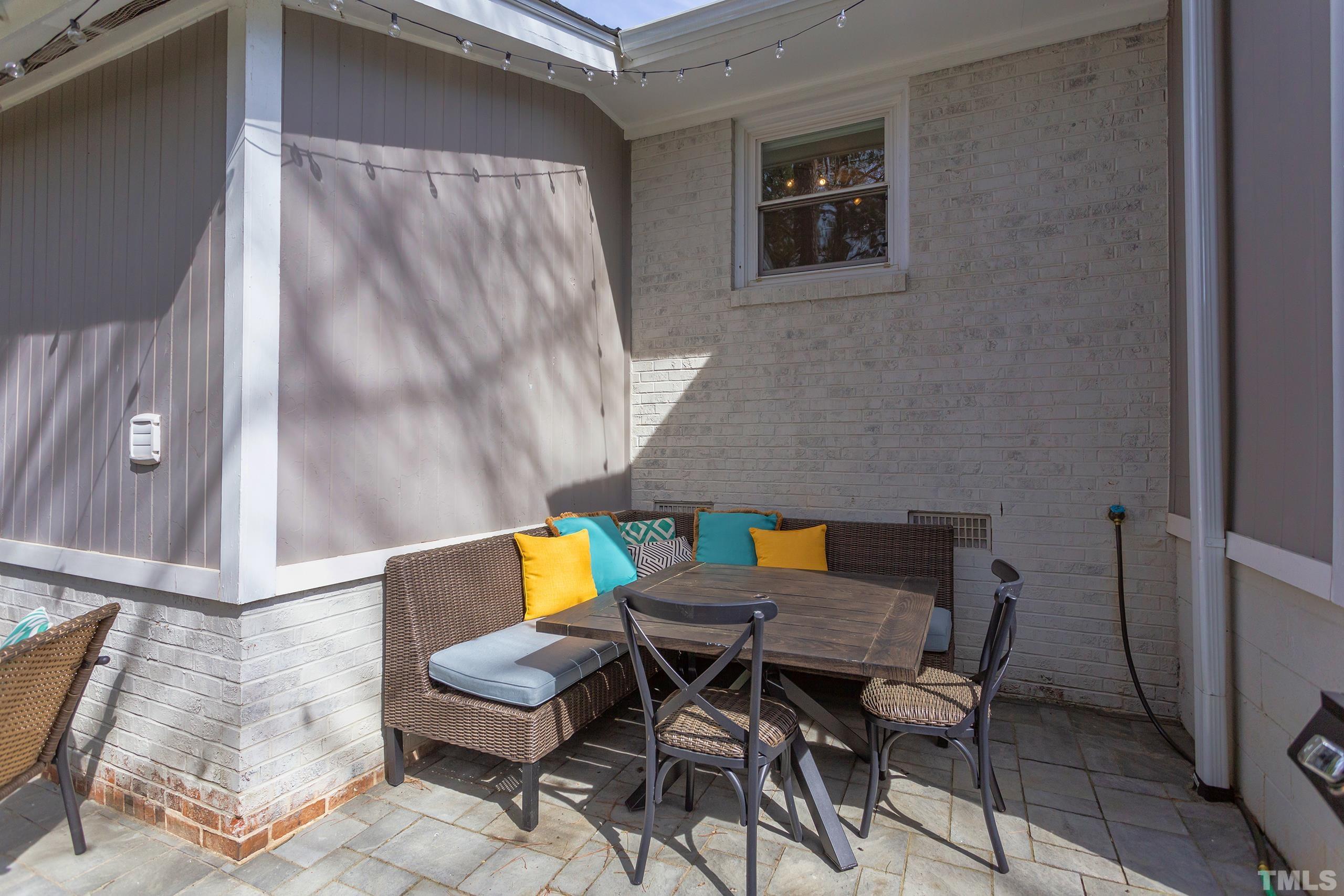 3314 Friar Tuck Road Raleigh, NC 27610 - Photo 28 of 42 a patio with a table and chairs