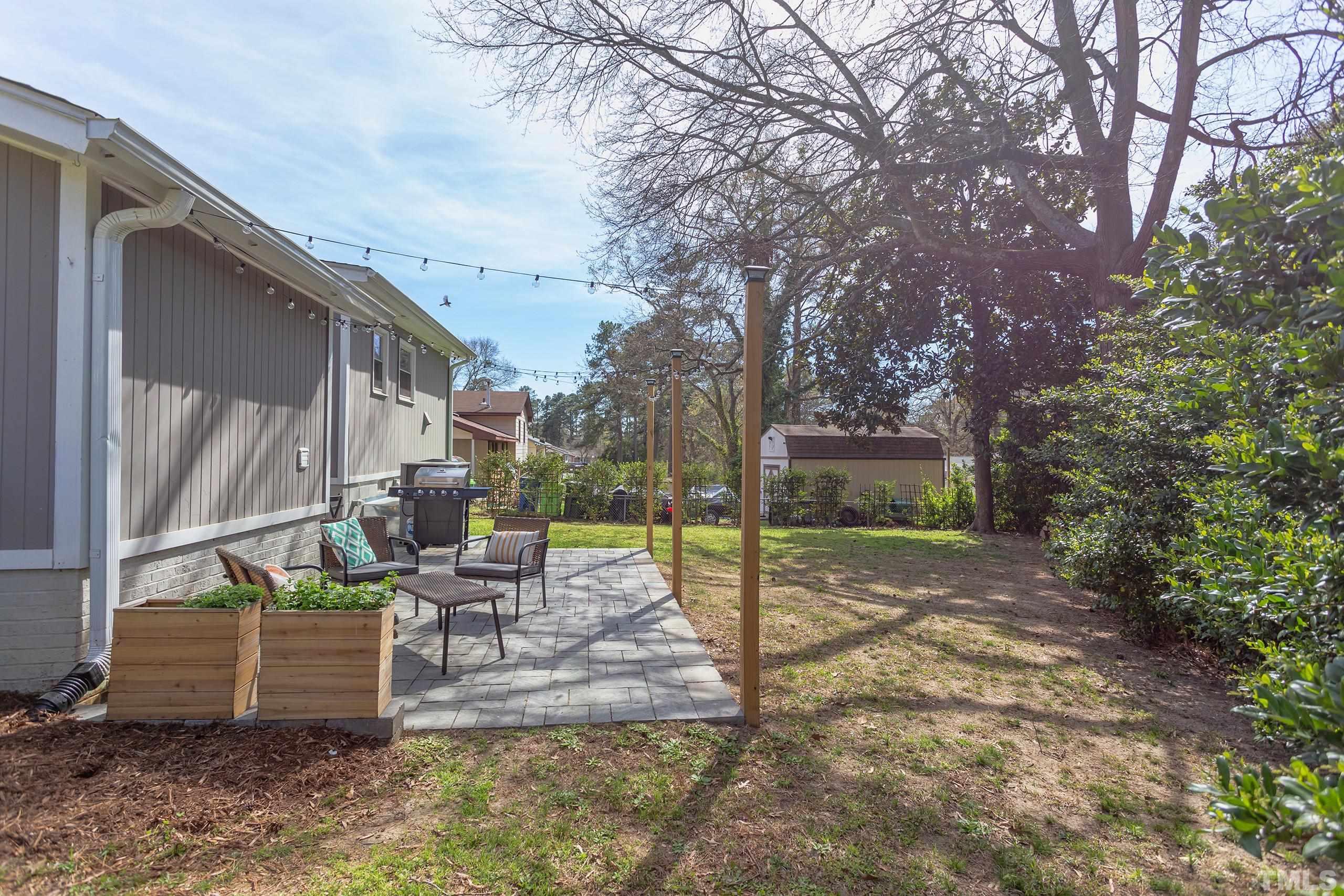 3314 Friar Tuck Road Raleigh, NC 27610 - Photo 39 of 42 a view of a house with backyard and sitting area