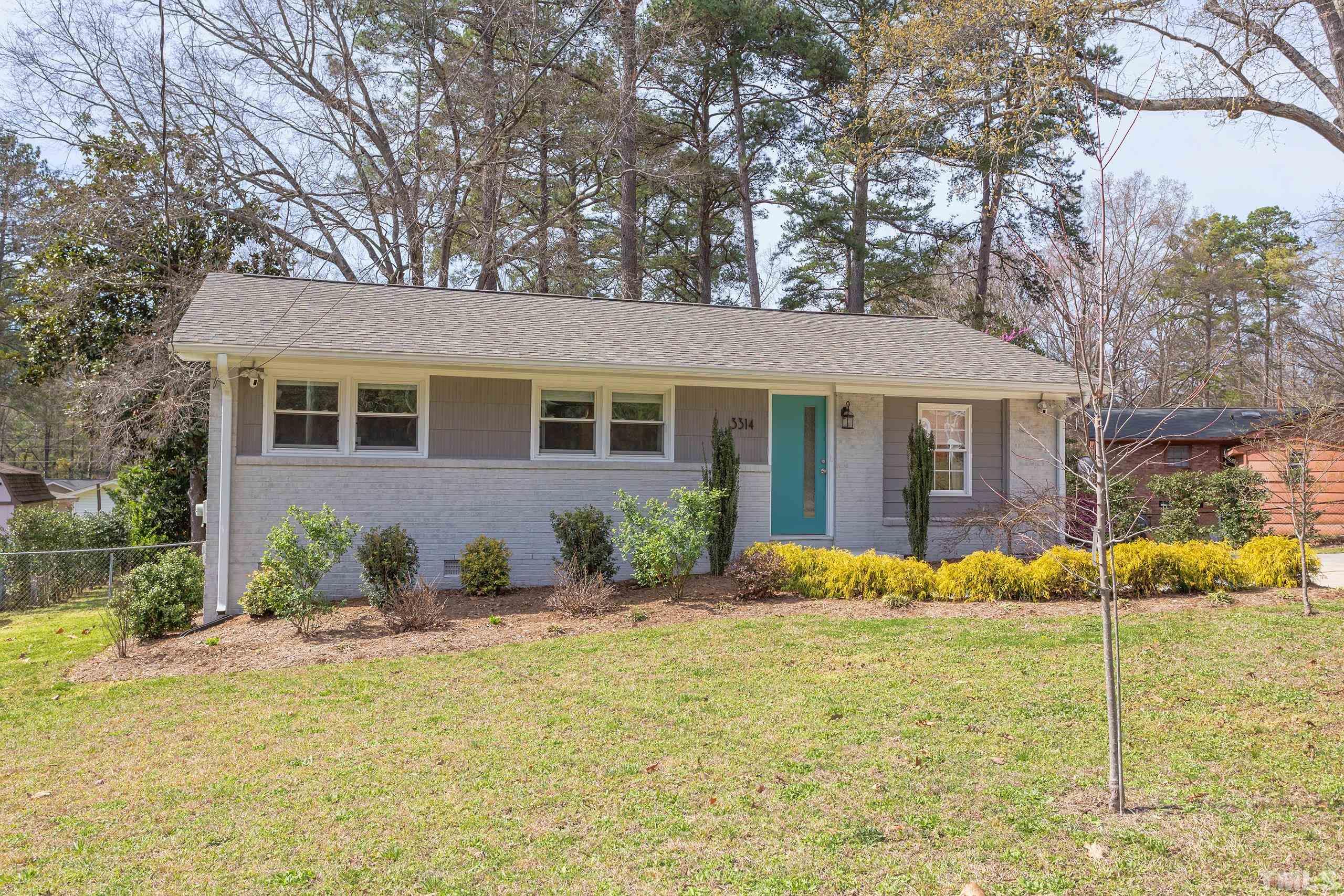 3314 Friar Tuck Road Raleigh, NC 27610 - Photo 41 of 42 a front view of a house with a yard