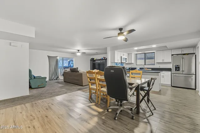 a view of a dining room with furniture and wooden floor