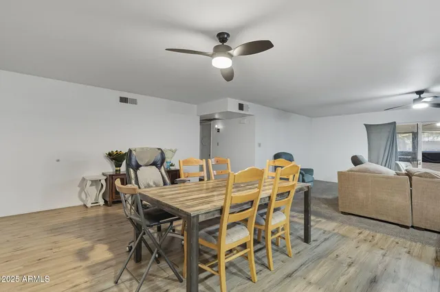 a dining room with furniture and window