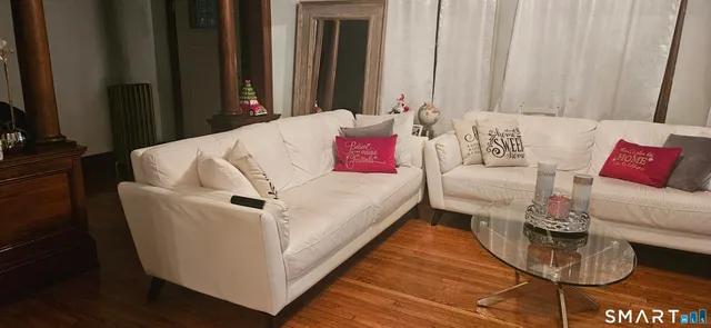 a living room with furniture and a couch