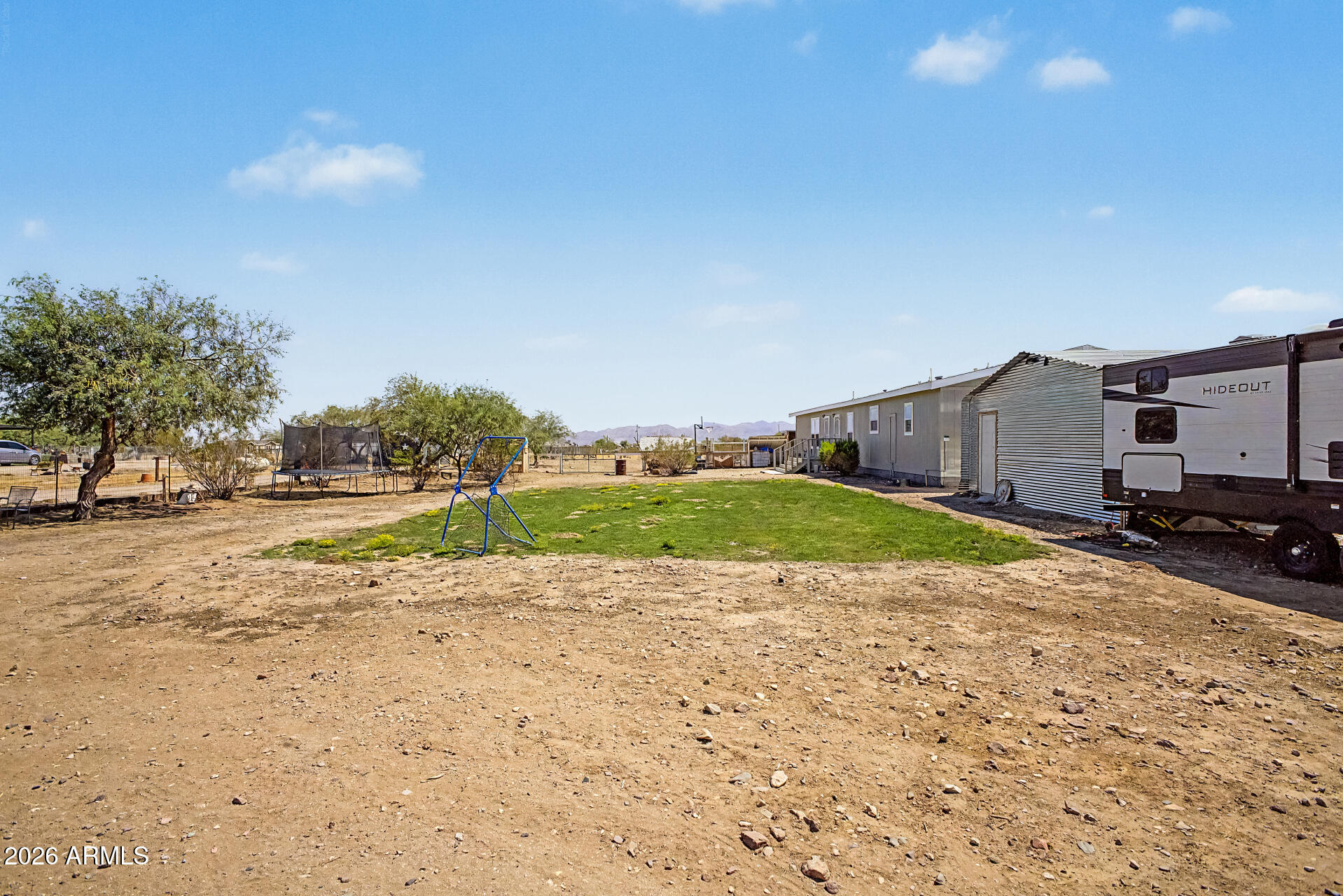 22417 West Dove Valley Road Wittmann, AZ 85361 - Photo 39 of 53 a view of a road with a house