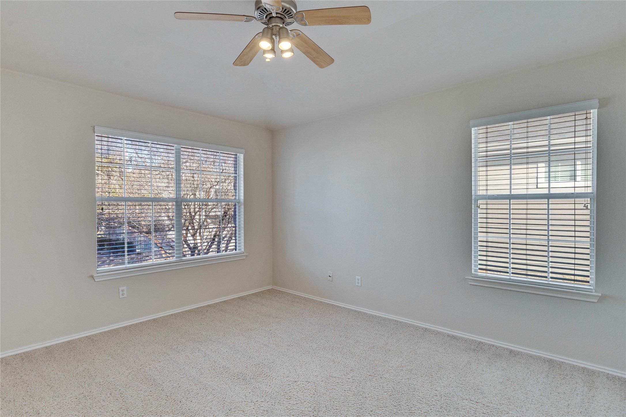 1900 Scofield Ridge Parkway, Unit 2701 Austin, TX 78727 - Photo 11 of 20 an empty room with windows and fan
