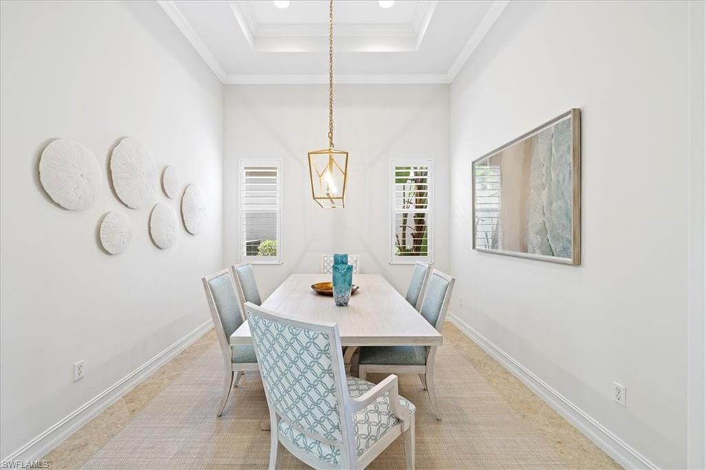 7831 Valencia Court Naples, FL 34113 - Photo 18 of 39 a dining room with furniture and window