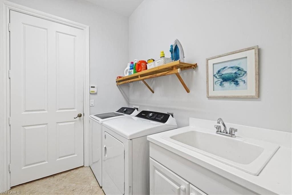 7831 Valencia Court Naples, FL 34113 - Photo 27 of 39 a utility room with dryer and washer