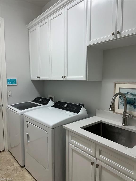 7831 Valencia Court Naples, FL 34113 - Photo 39 of 39 a utility room with dryer and washer