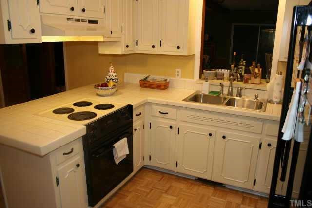 Great kitchen with tile counters, black appliances, &amp; pantry Other
