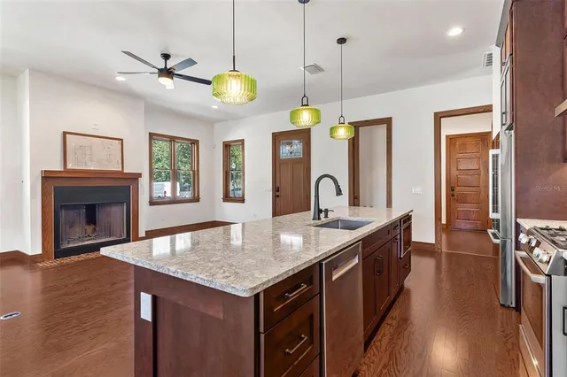 a kitchen with a counter space a sink and appliances