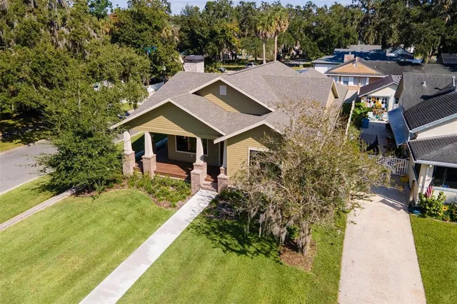 a aerial view of a house with swimming pool and garden