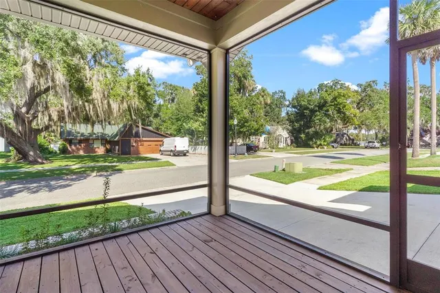 a view of a porch and wooden floor