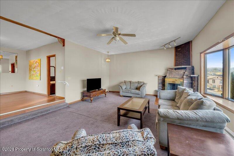 1228 Lake Road Factoryville, PA 18419 - Photo 28 of 43 a living room with furniture and a flat screen tv