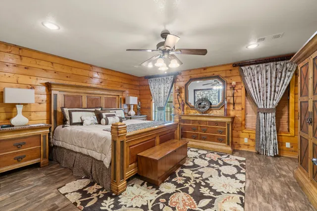 a bed room with two bed and a chandelier