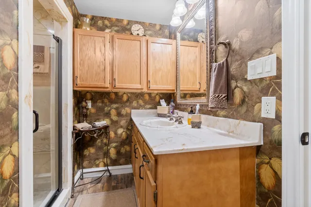 a bathroom with a sink and a mirror