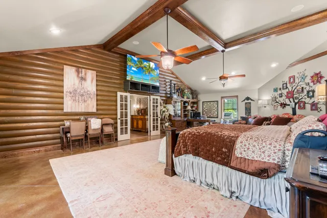 a bed room with furniture and a chandelier