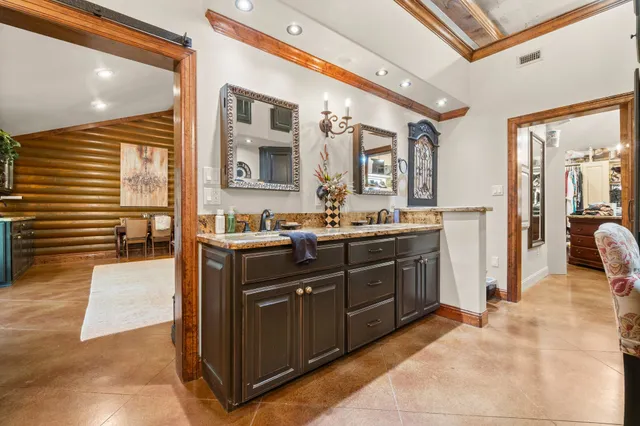 a kitchen with a sink and cabinets
