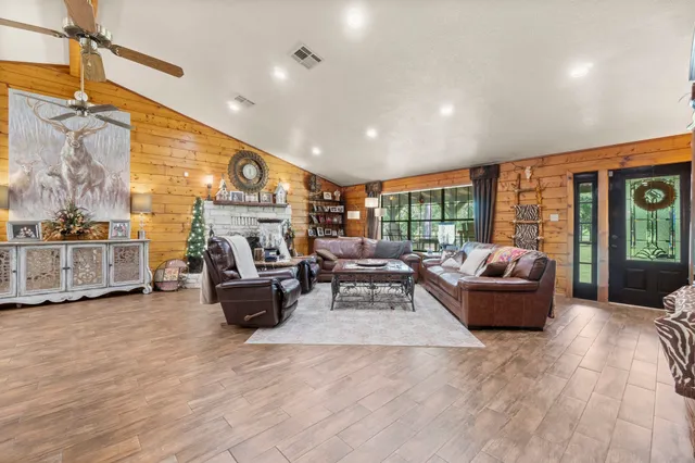 a living room with furniture and a large window