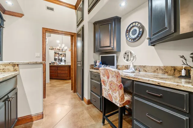 a kitchen with a sink and a stove top oven