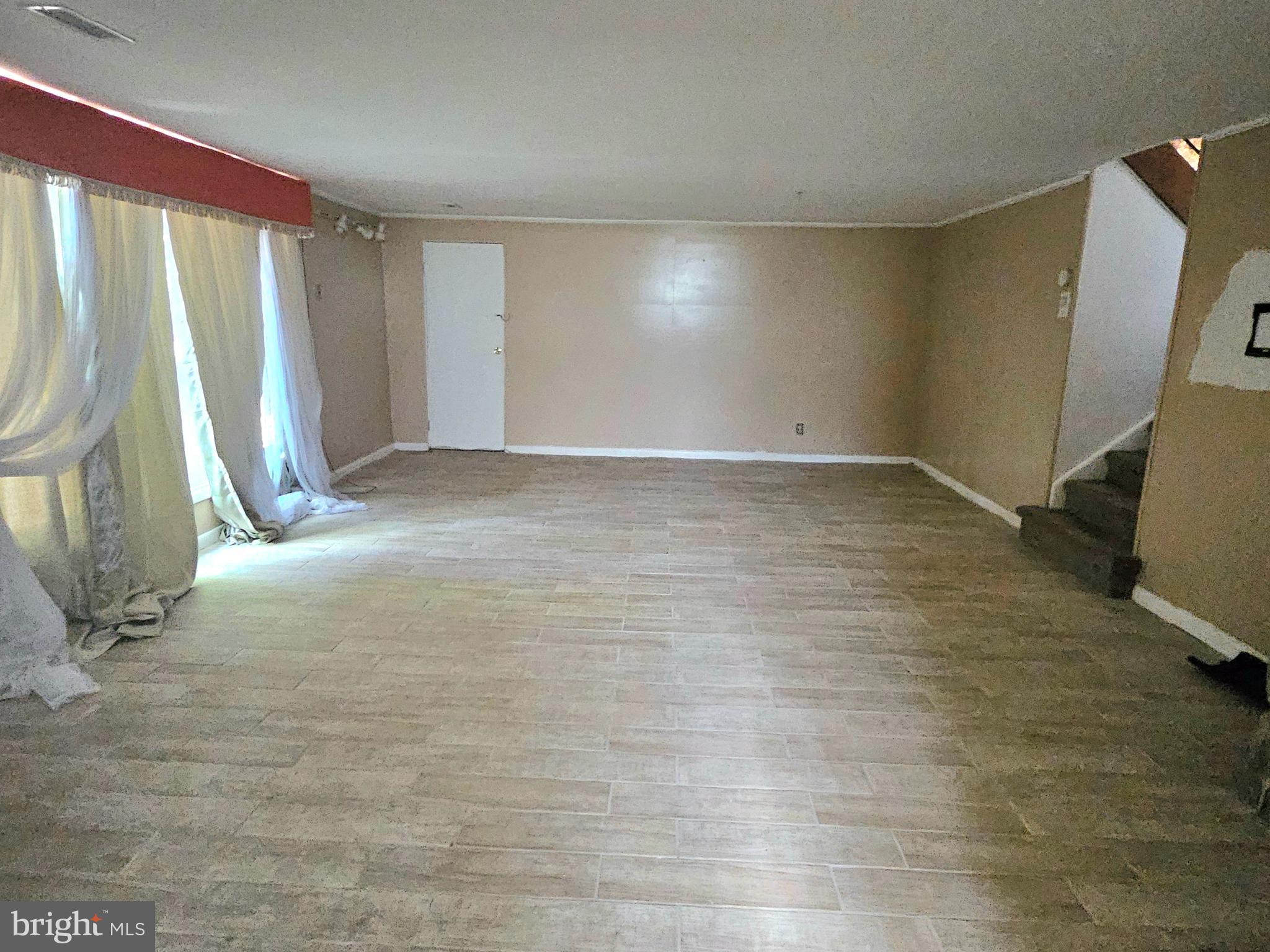 148 Church Road Elkins Park, PA 19027 - Photo 28 of 33 a view of empty room with wooden floor and fan