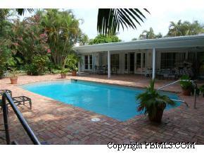 242 Kenlyn Road Palm Beach, FL 33480 - Photo 1 of 7 a view of a house with a yard