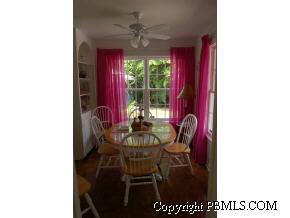 242 Kenlyn Road Palm Beach, FL 33480 - Photo 2 of 7 a view of a dining room with furniture and window