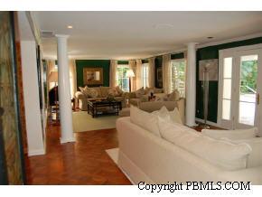 242 Kenlyn Road Palm Beach, FL 33480 - Photo 5 of 7 a living room with furniture and large windows