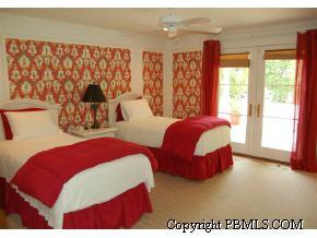 242 Kenlyn Road Palm Beach, FL 33480 - Photo 7 of 7 a bedroom with a large bed and a window