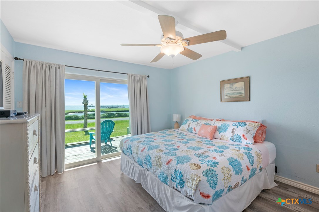 2003 North Fulton Beach Road, Unit 77 Rockport, TX 78382 - Photo 15 of 33 a bedroom with a bed and a window