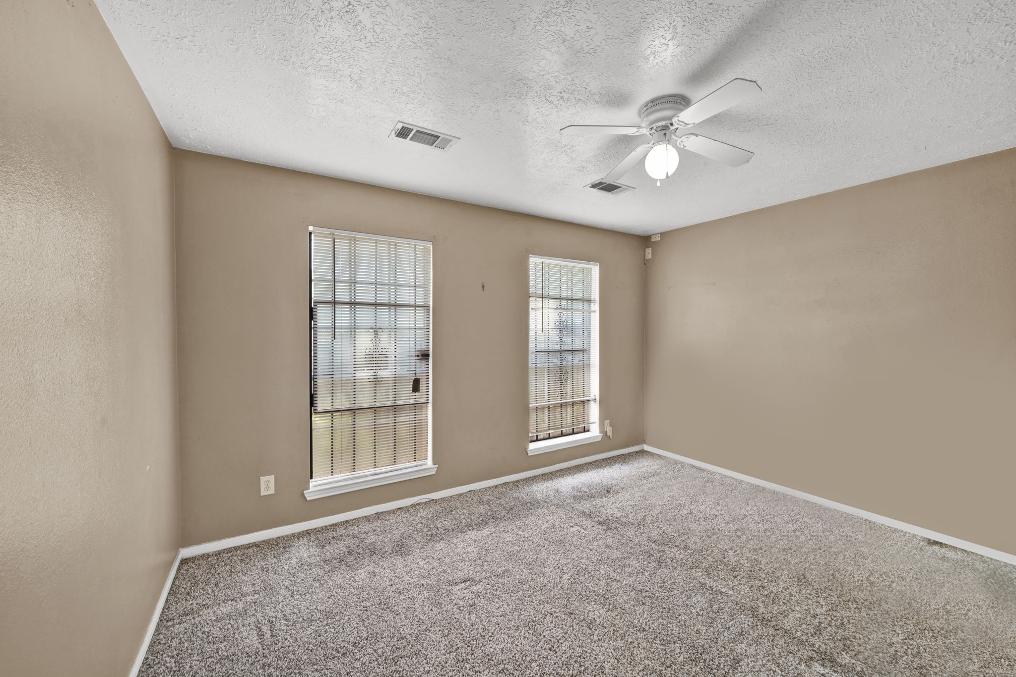 12821 Donegal Way Houston, TX 77047 - Photo 13 of 18 a view of an empty room with a window