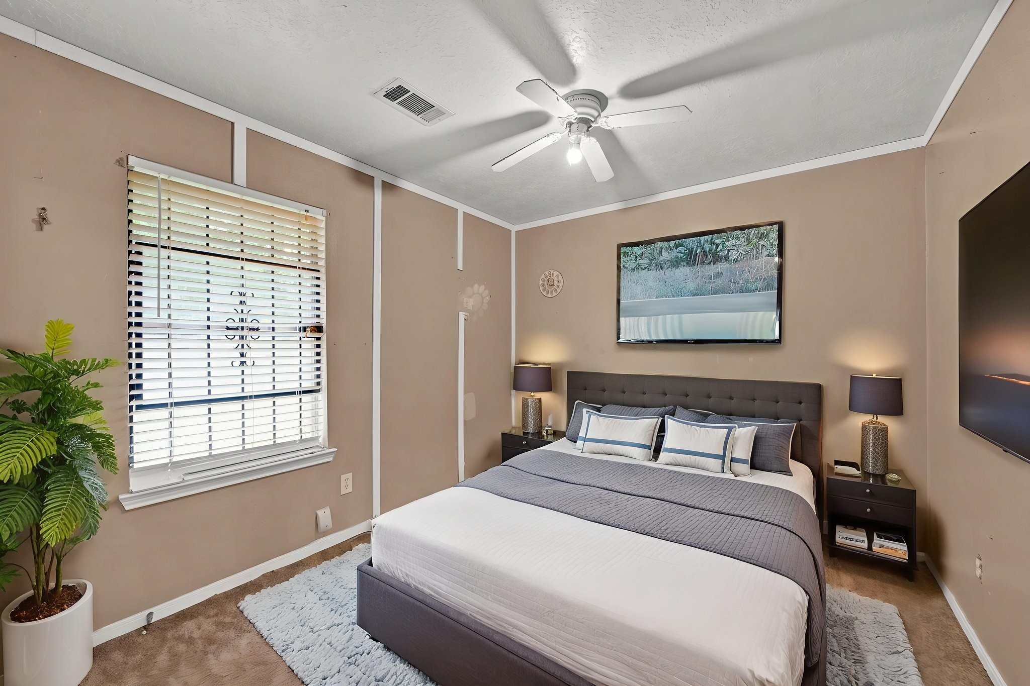 12821 Donegal Way Houston, TX 77047 - Photo 14 of 18 a bedroom with a large bed and a window