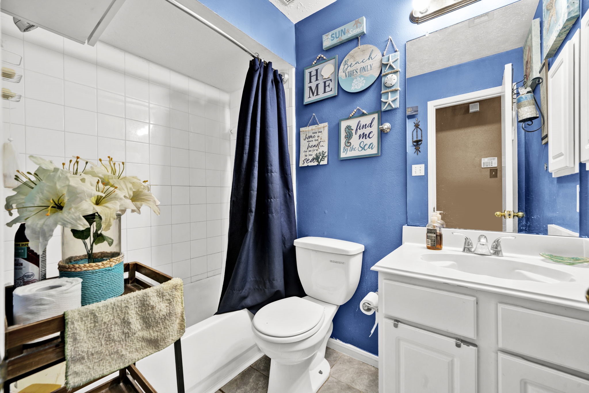 12821 Donegal Way Houston, TX 77047 - Photo 17 of 18 a bathroom with a toilet sink and mirror
