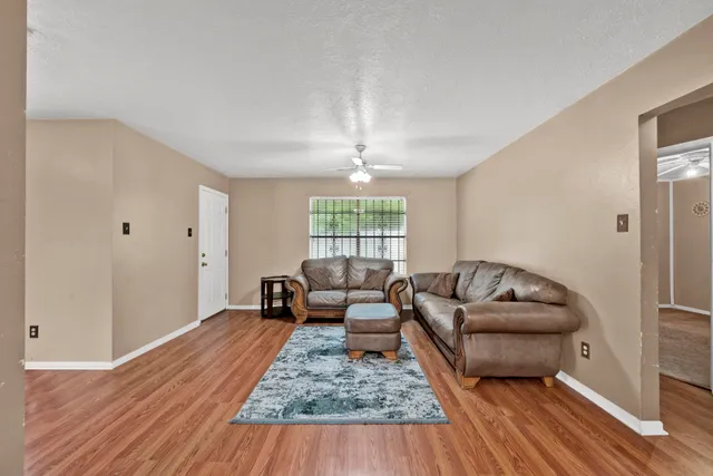 a living room with furniture and a rug