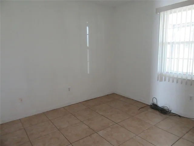 an empty room with a empty space and window