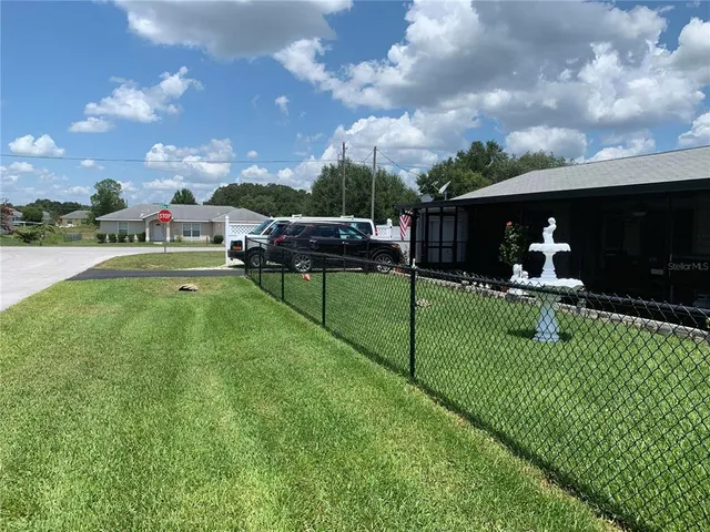 a childrens park with lots of swings slides and swimming pool