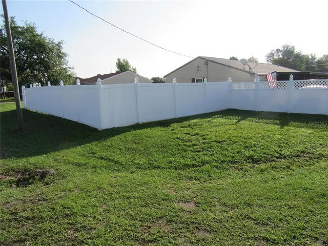 a backyard view with hardwood wall