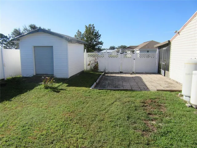 a backyard of a house with lots of green space