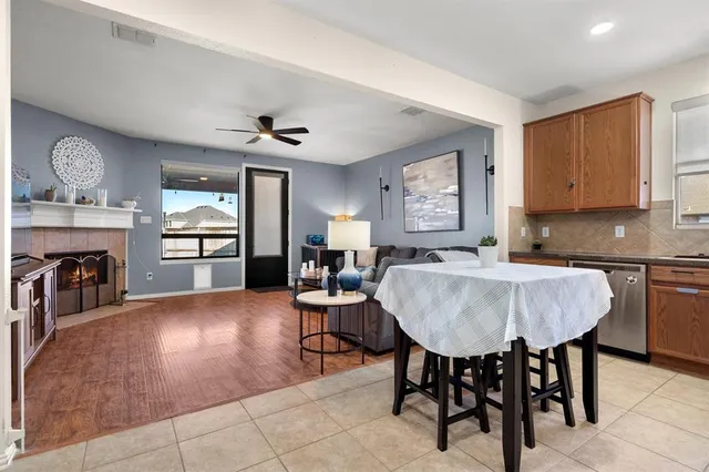 a living room with fireplace furniture and a window