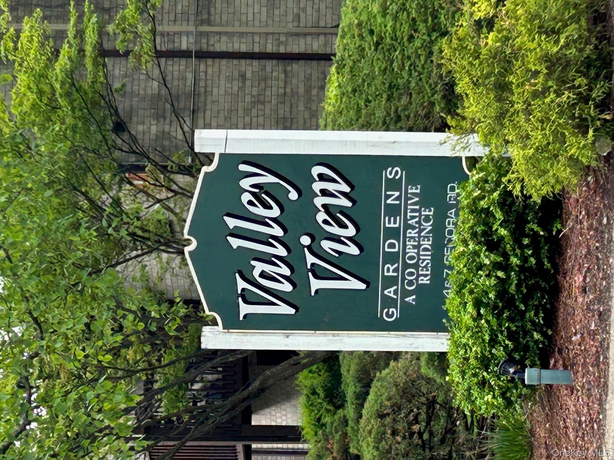 a sign broad in front of a brick building