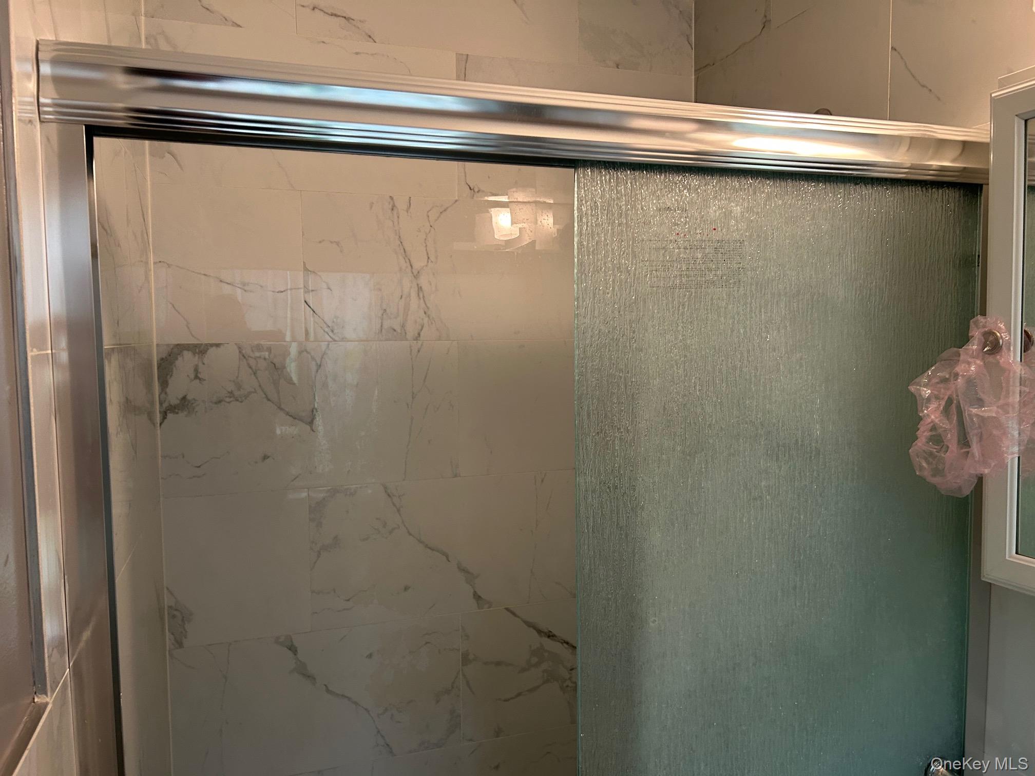 2 Secora Road, Unit C20 Monsey, NY 10952 - Photo 21 of 34 a close up of a shower
