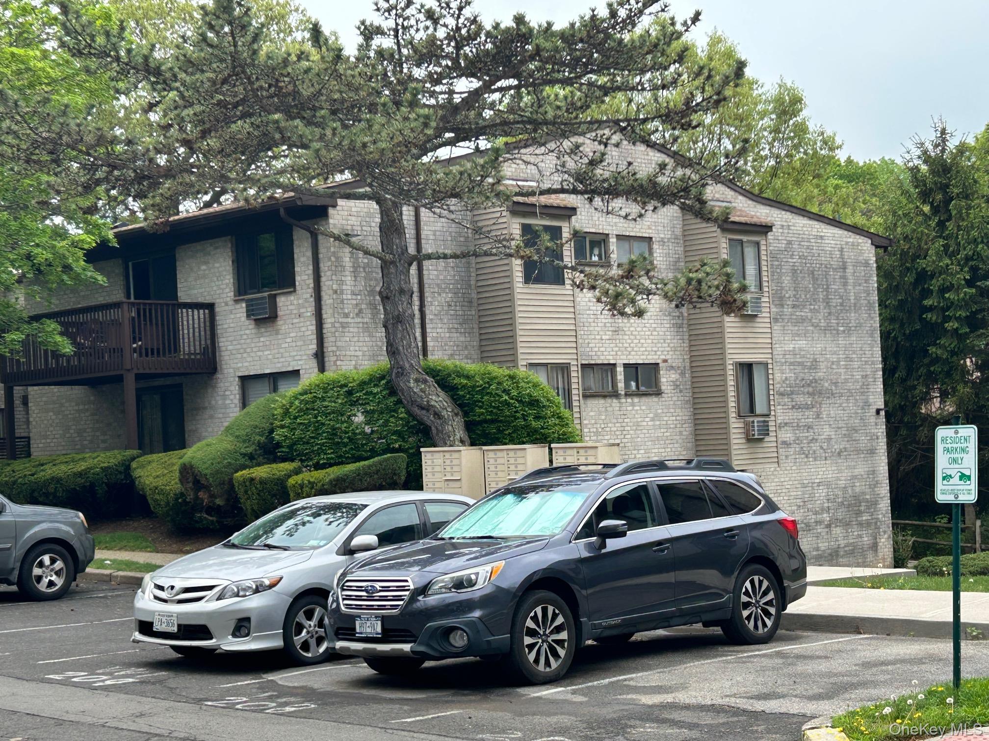 2 Secora Road, Unit C20 Monsey, NY 10952 - Photo 3 of 34 a car parked in front of a house