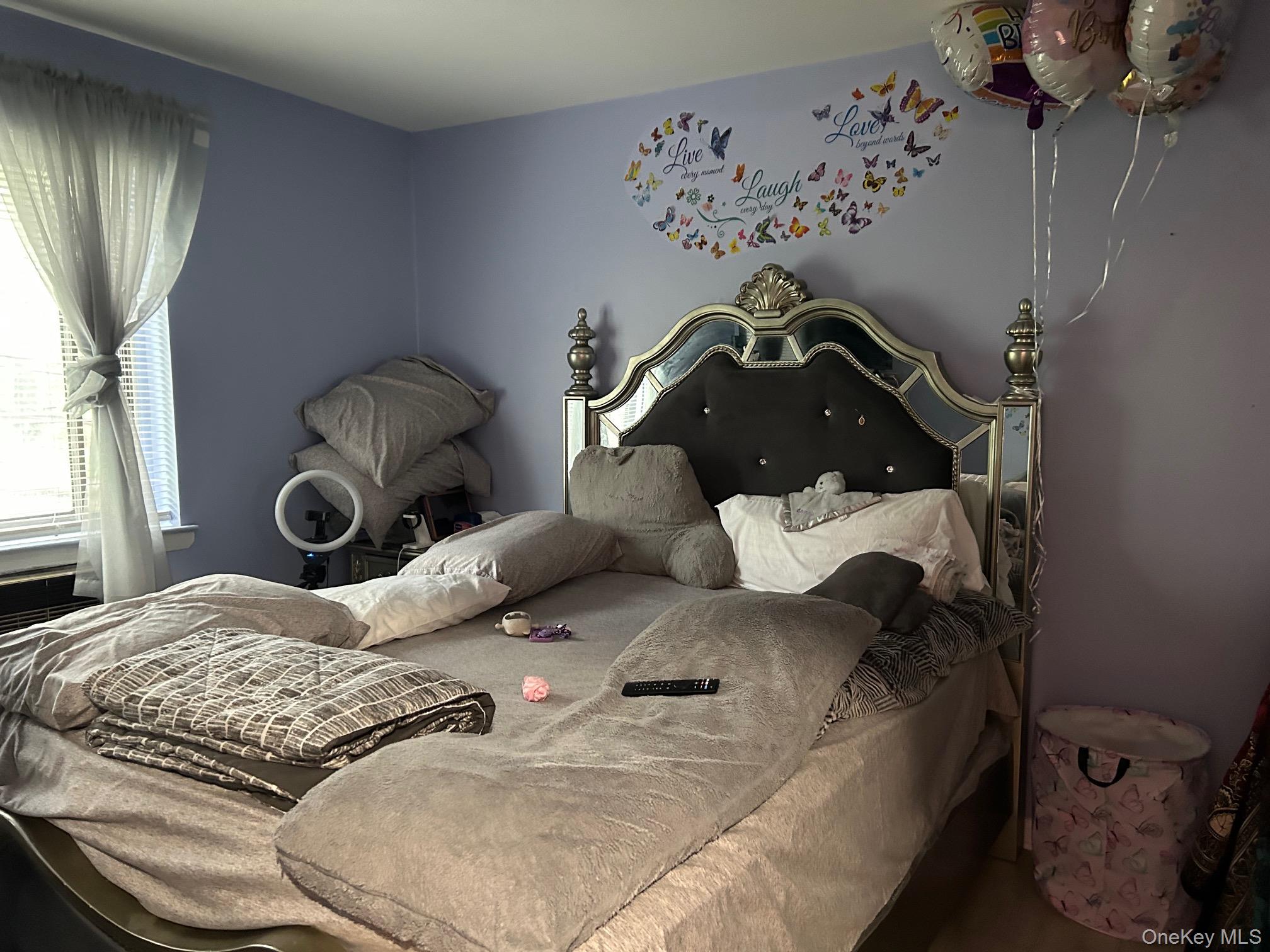 2 Secora Road, Unit C20 Monsey, NY 10952 - Photo 33 of 34 a bedroom with a bed and wall painting on the wall