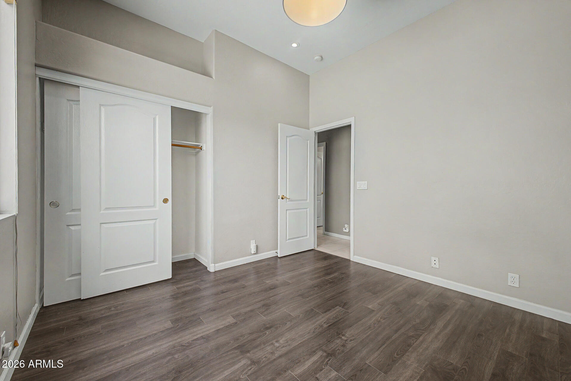 1632 West Frye Road Phoenix, AZ 85045 - Photo 19 of 37 a view of an empty room with wooden floor
