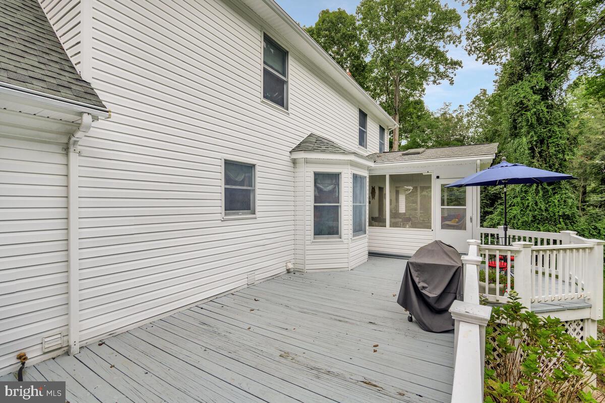 3897 Hunting Creek Road Huntingtown, MD 20639 - Photo 25 of 75 a view of a house with a deck